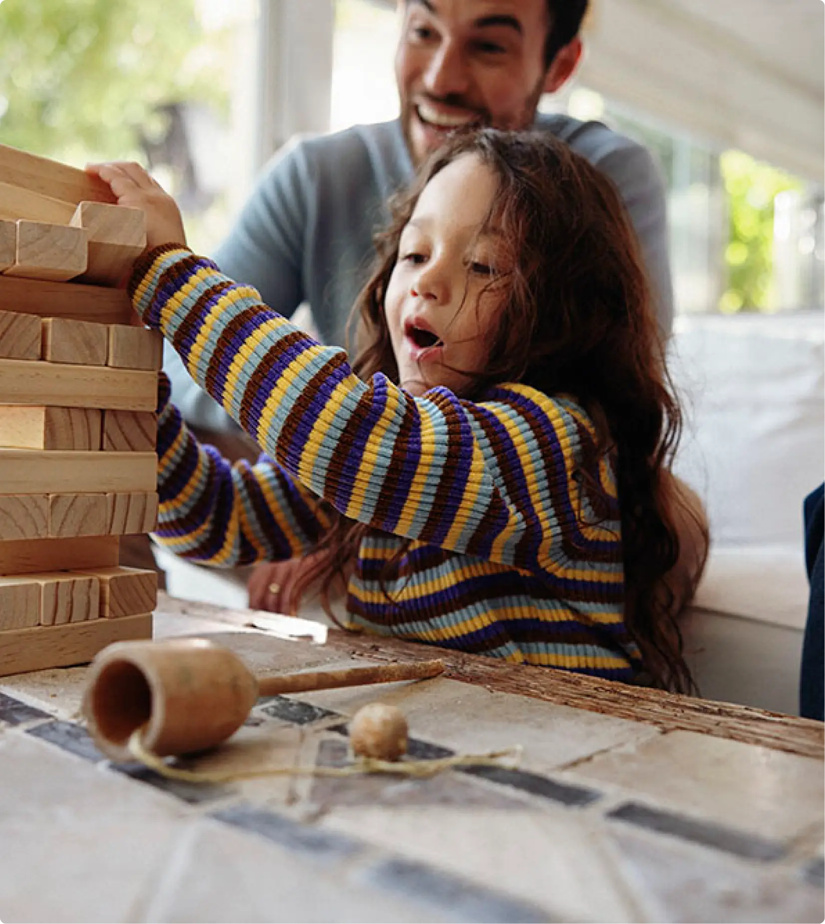 Family playing block tower game